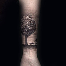 man-walking-dog-under-tree-mens-forearm-tattoos.jpg