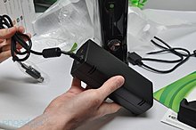 64399d1276549314-xbox-360-slim-slim-unboxing33-hands.jpg
